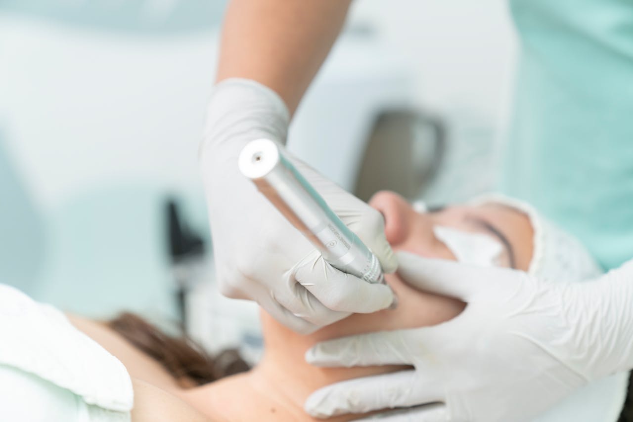 Close-up of a cosmetic treatment being performed in a clinical environment.